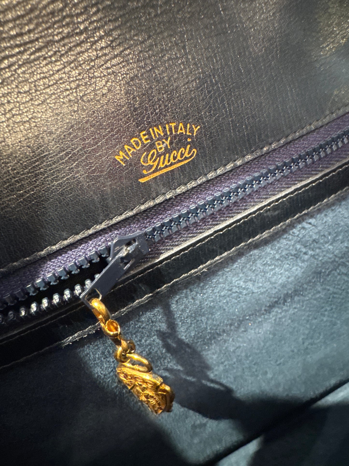 An original 1970s Gucci Blondie bag in midnight blue suede with gold double GG. Snap closure recently replaced.