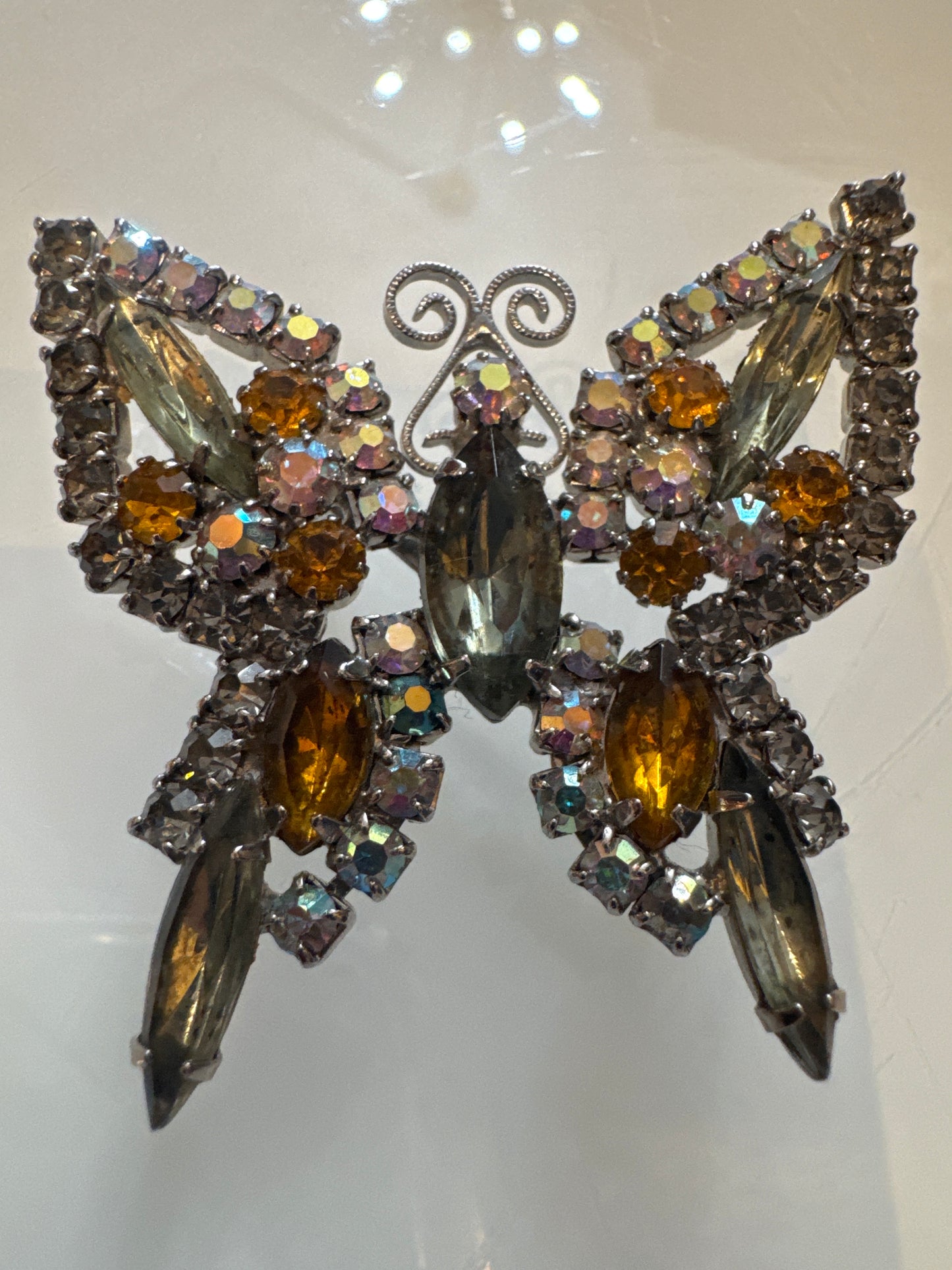 Beautiful 1950s rhinestone butterfly with amber and champagne colored rhinestones and smoky gray navettes