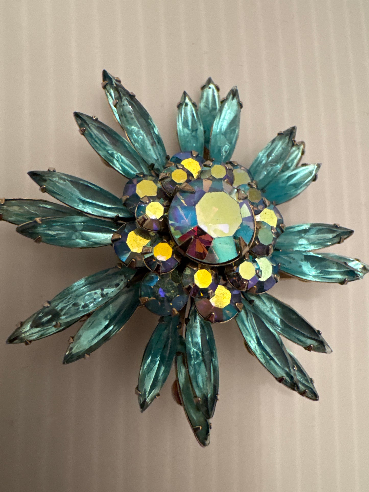 Beautiful signed Judy lee turquoise colored rhinestone flower brooch. Paris live
