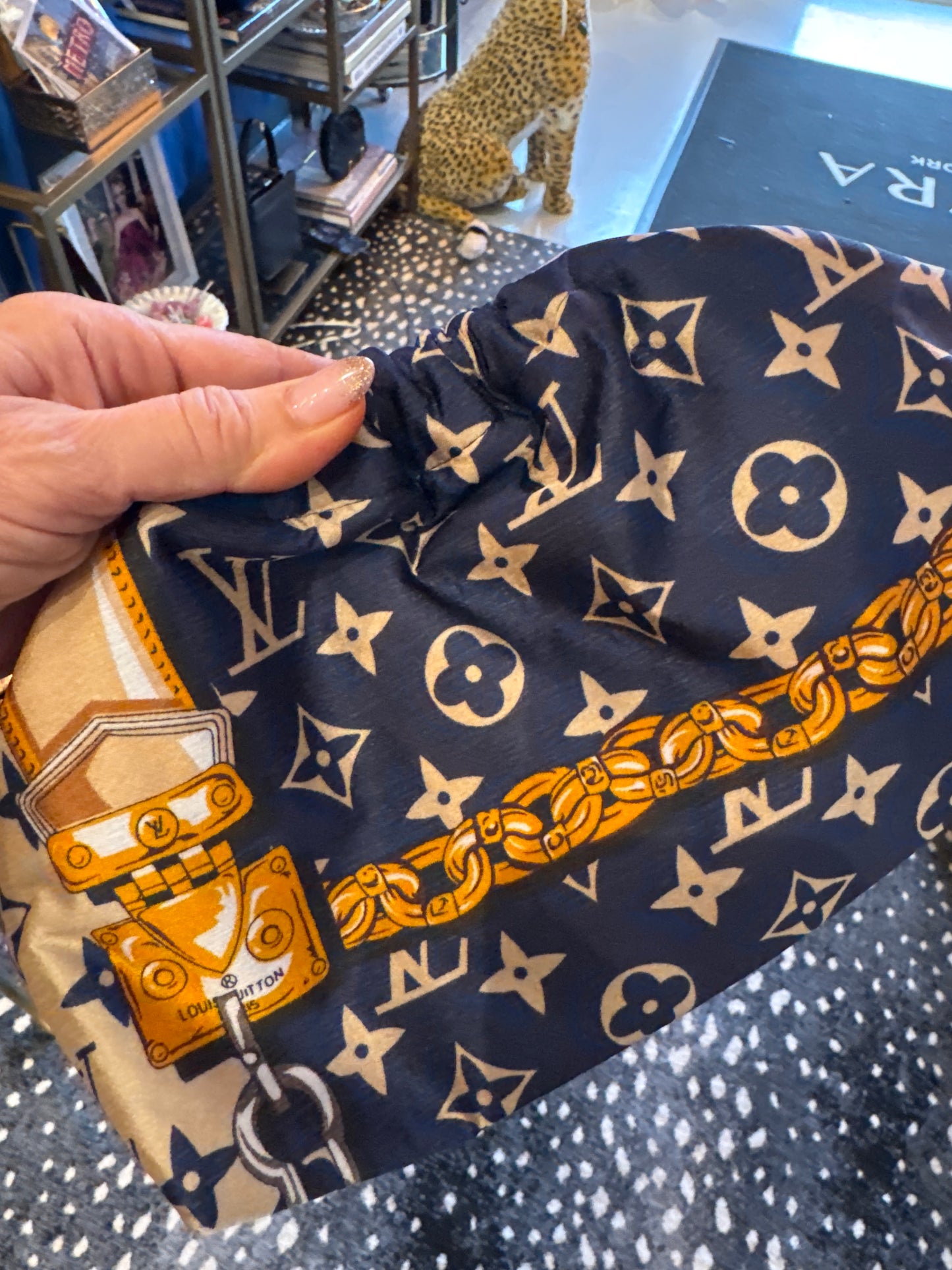 Vintage medium navy silk scarf reimagined as a clutch bag. Comes with crossbody chain shown