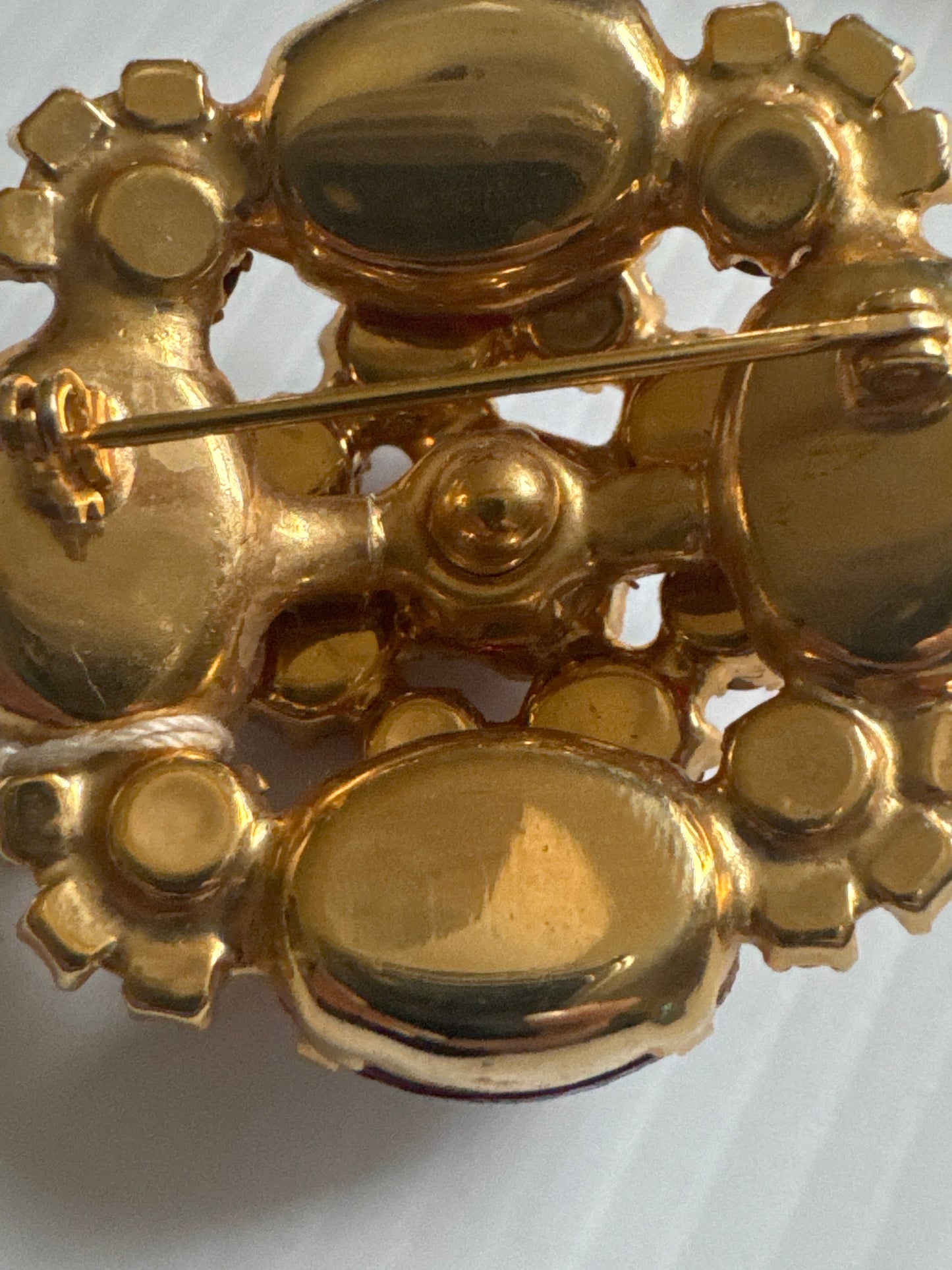 1950s stunning, brooch, and earrings set featuring red rhinestones and Aurora borealis