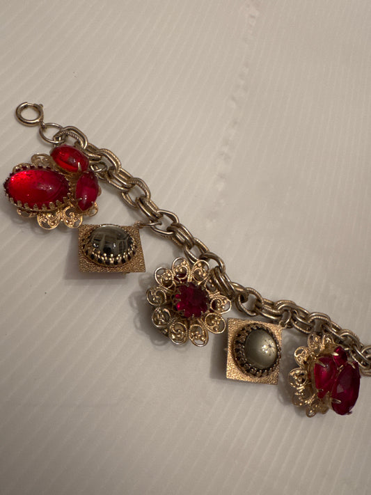 Wonderful RARE vintage double sided charm bracelet in gold tone with red stones and fabulous moonstones