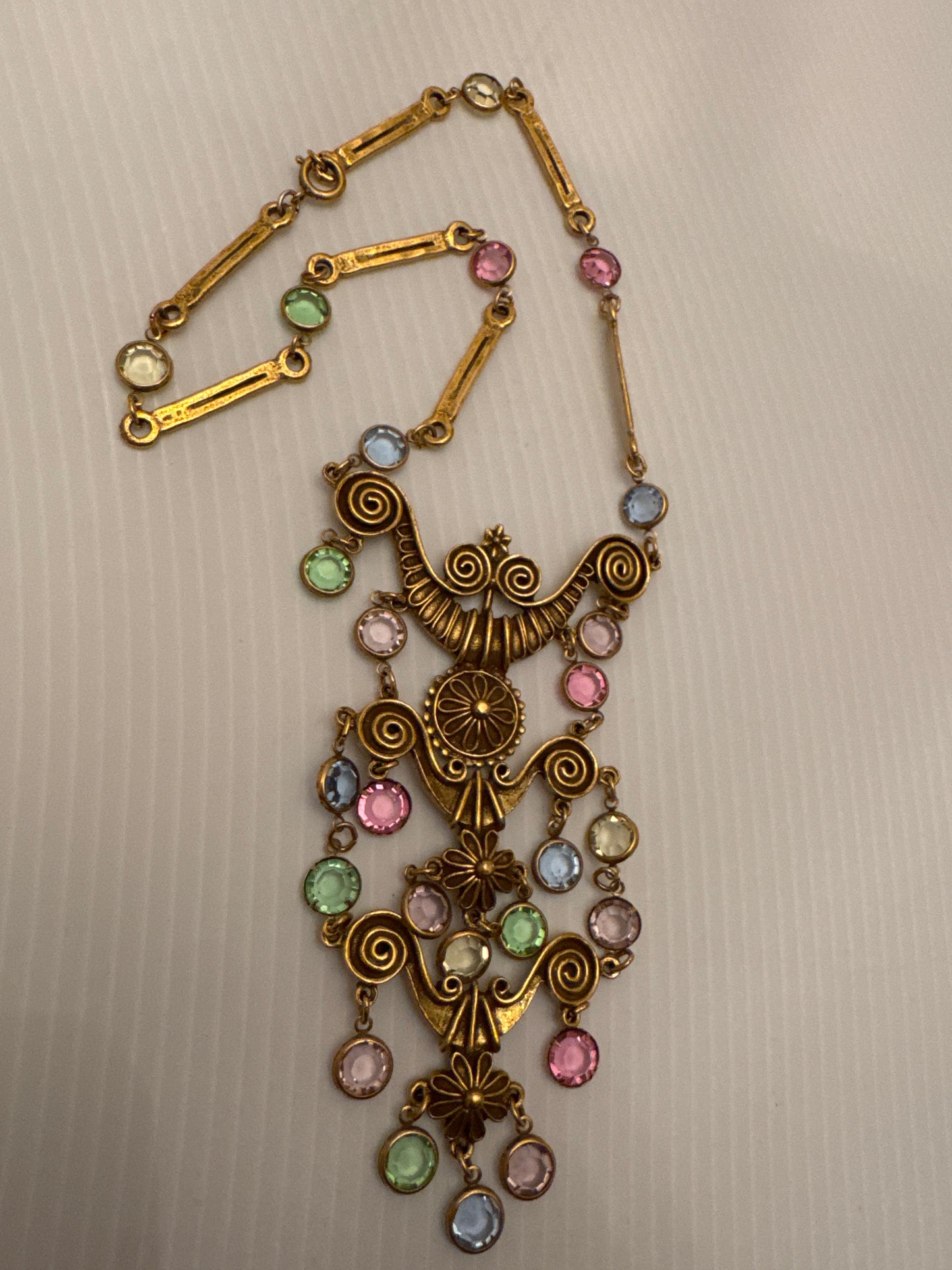 Beautiful gold tone unsigned Goldette dangle pendant with pastel crystals. PARIS LIVE.