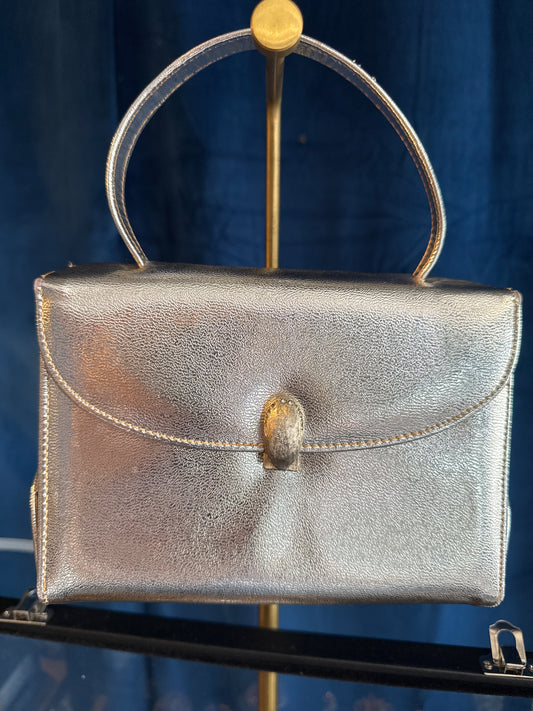 Adorable 1950s silver top handle bag with rhinestone clasp