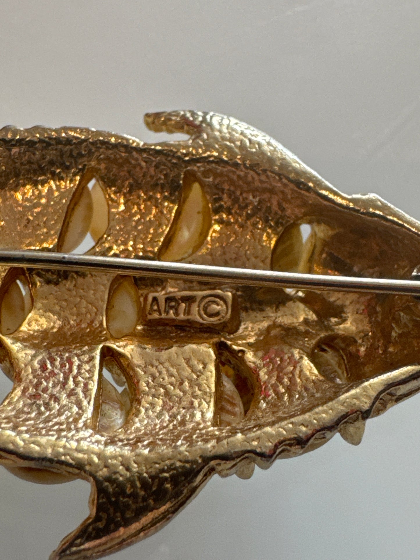 Vintage gold tone with mother of pearl fish scale brooch signed ART. Arthur Pepper.