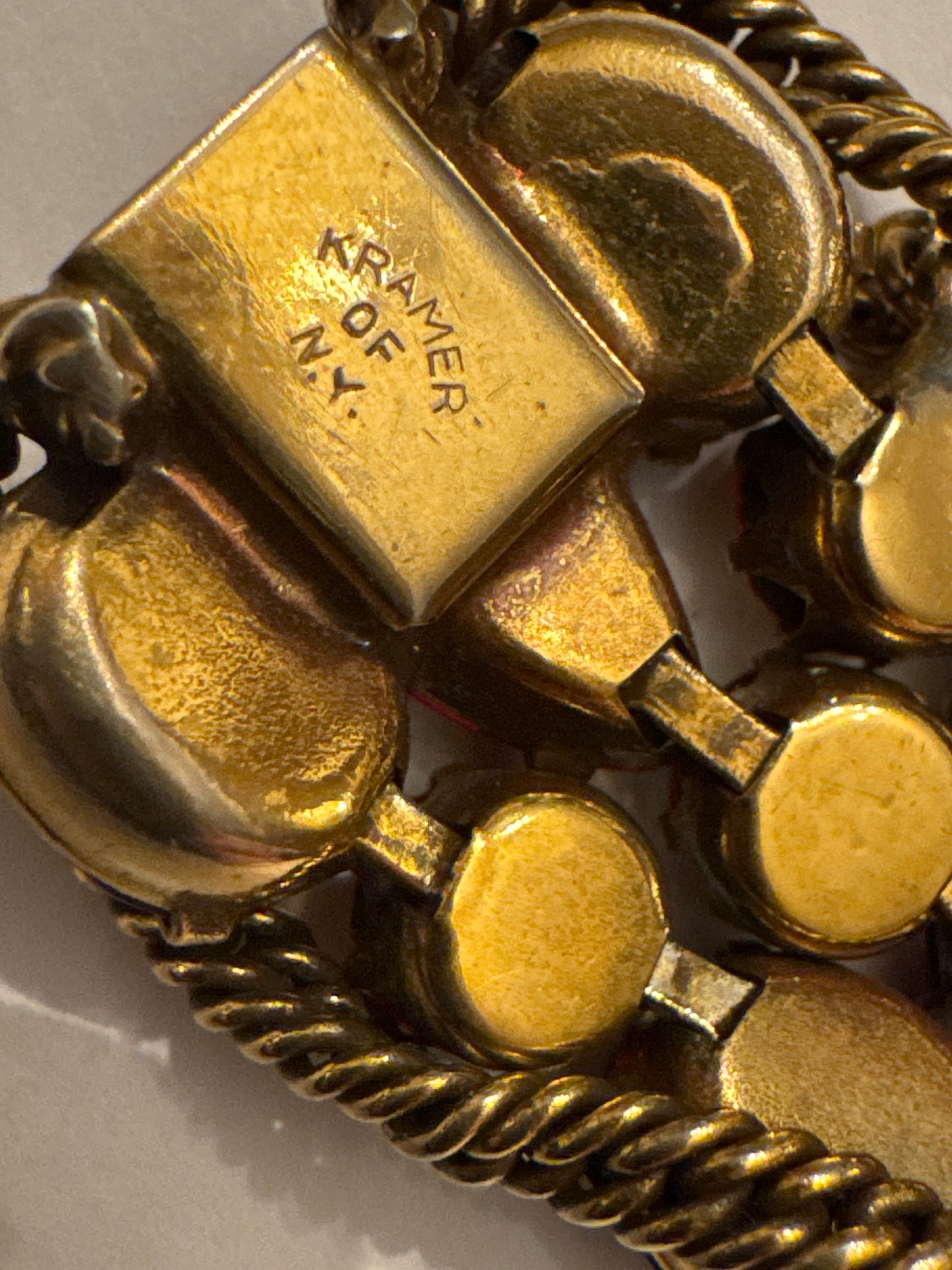 1950s signed KRAMER of NY rhinestone bracelet featuring red crystals and aurora borealis with a gold link chain throughout 