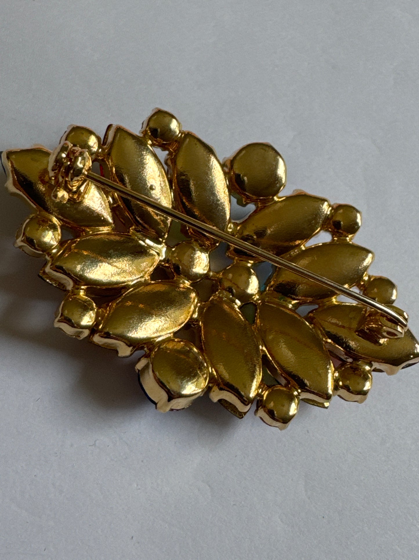 1960s cheerful and colorful, fruit salad brooch featuring colored navette rhinestones