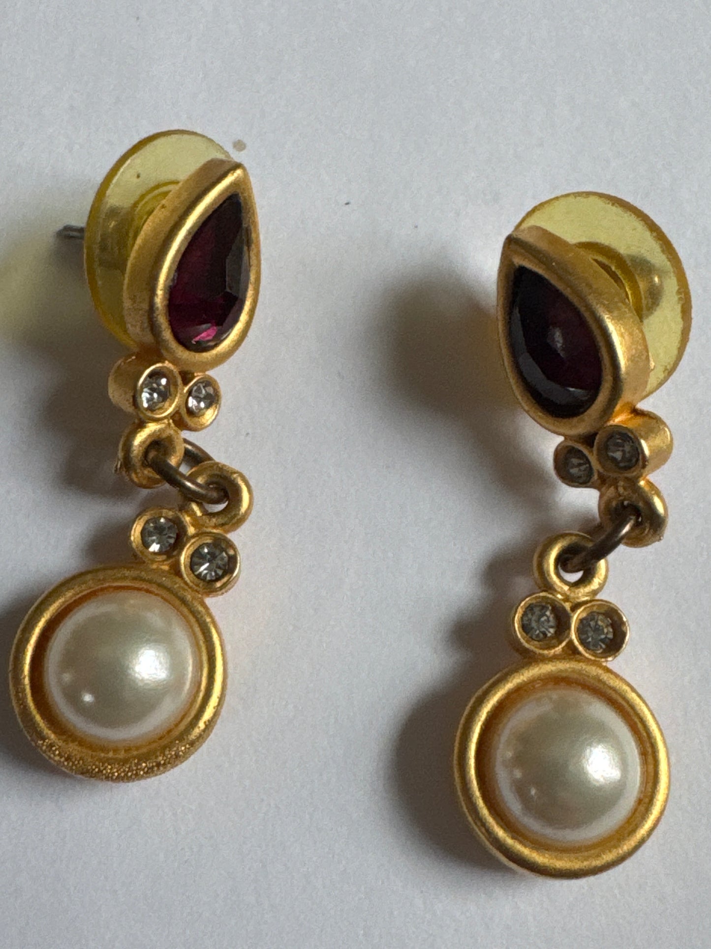 1990s pierced dangle matte gold tone earrings with Ruby crystal stones and faux pearl dangle