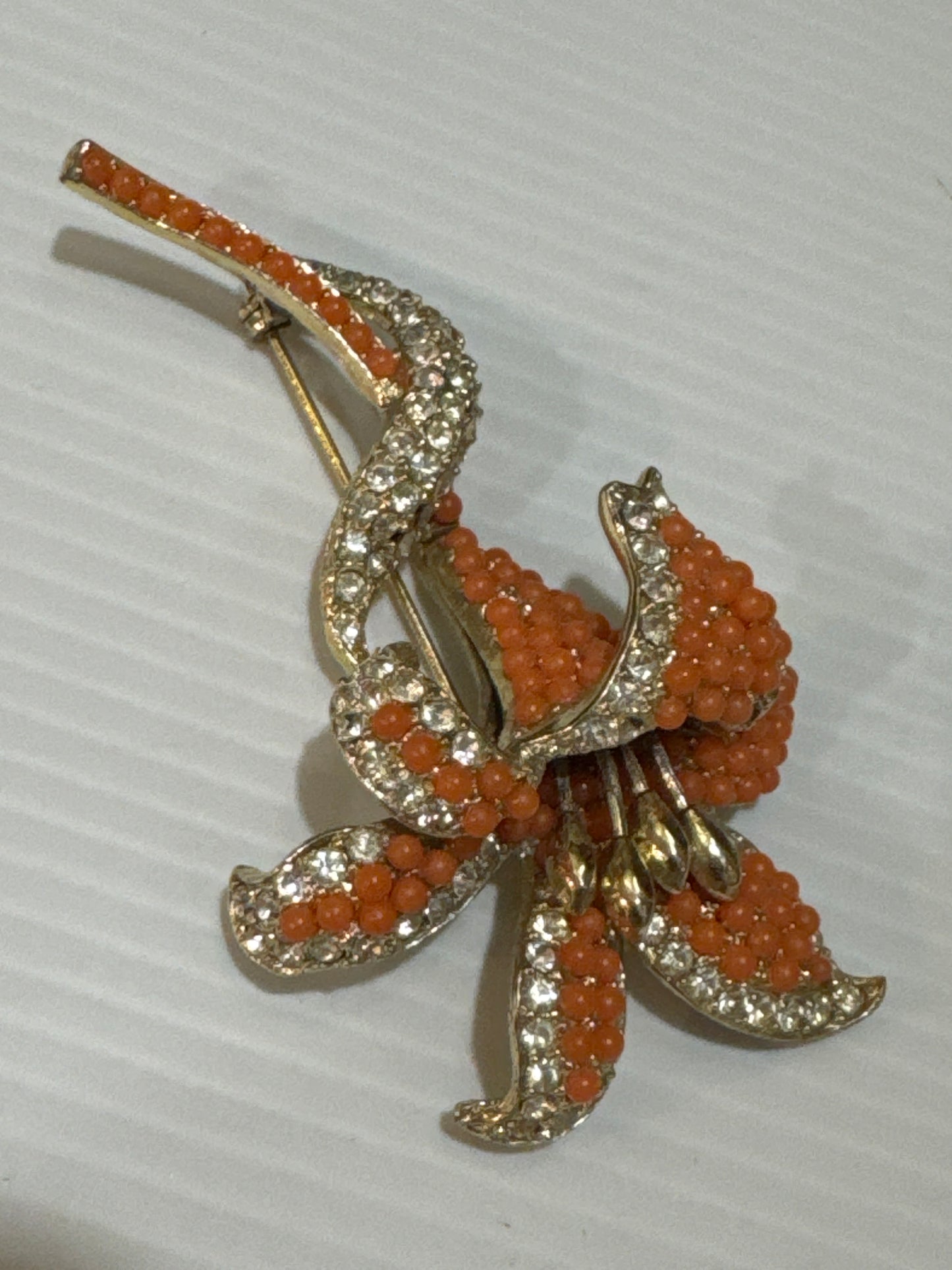 1950s absolutely stunning, coral and clear rhinestone multidimensional flower brooch. Jackpot.