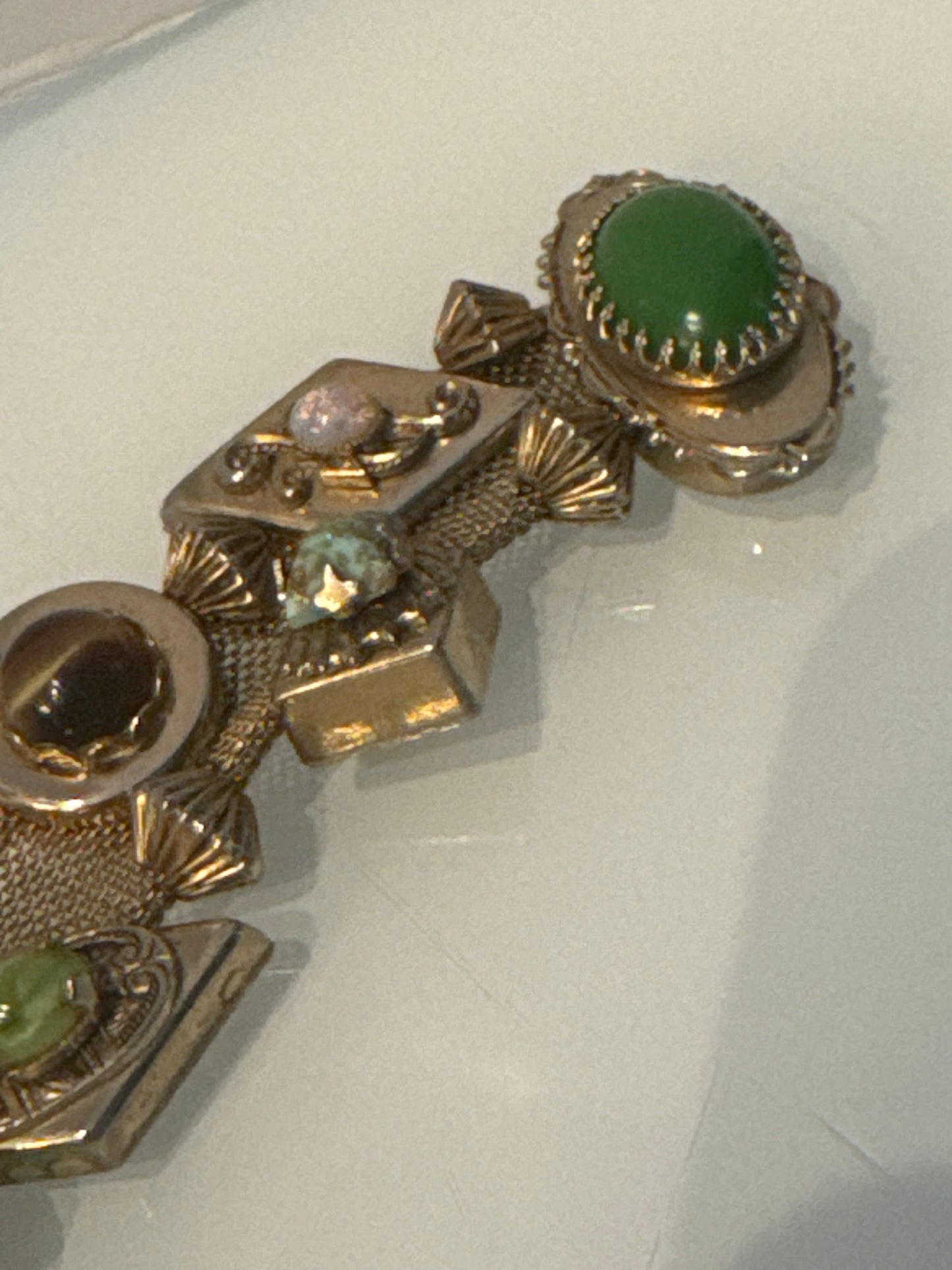 Stunning wire gold tone slider bracelet with over 10 charms. Sourced in Paris.
