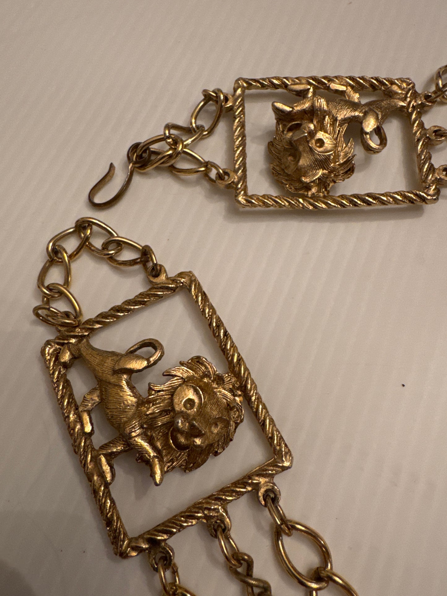 Vintage 1970s gold tone, lion embellished belt