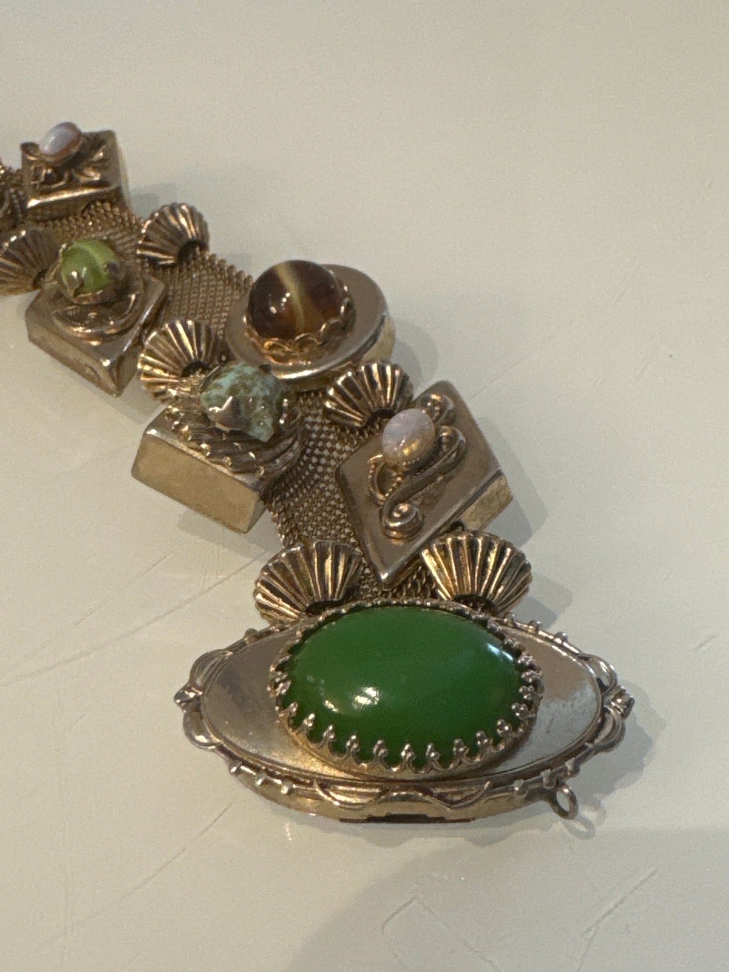 Stunning wire gold tone slider bracelet with over 10 charms. Sourced in Paris.