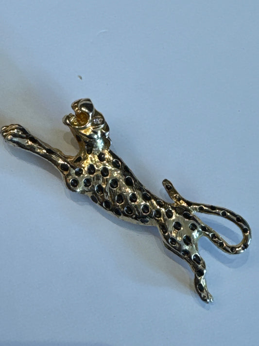 vintage gold tone, panther brooch with enamel and rhinestone eyes