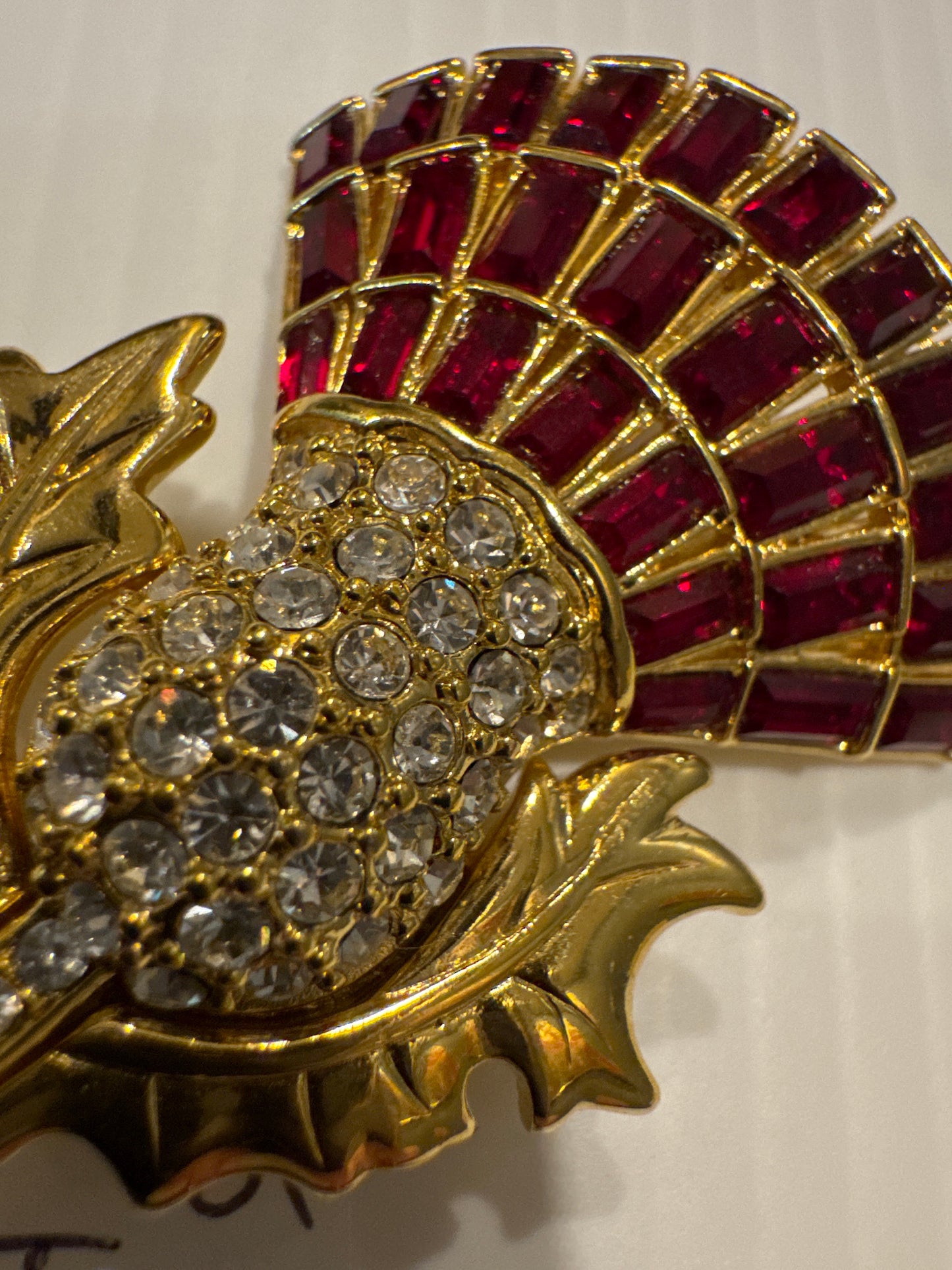Gorgeous vintage signed Nolan Miller with red and clear rhinestones flower brooch