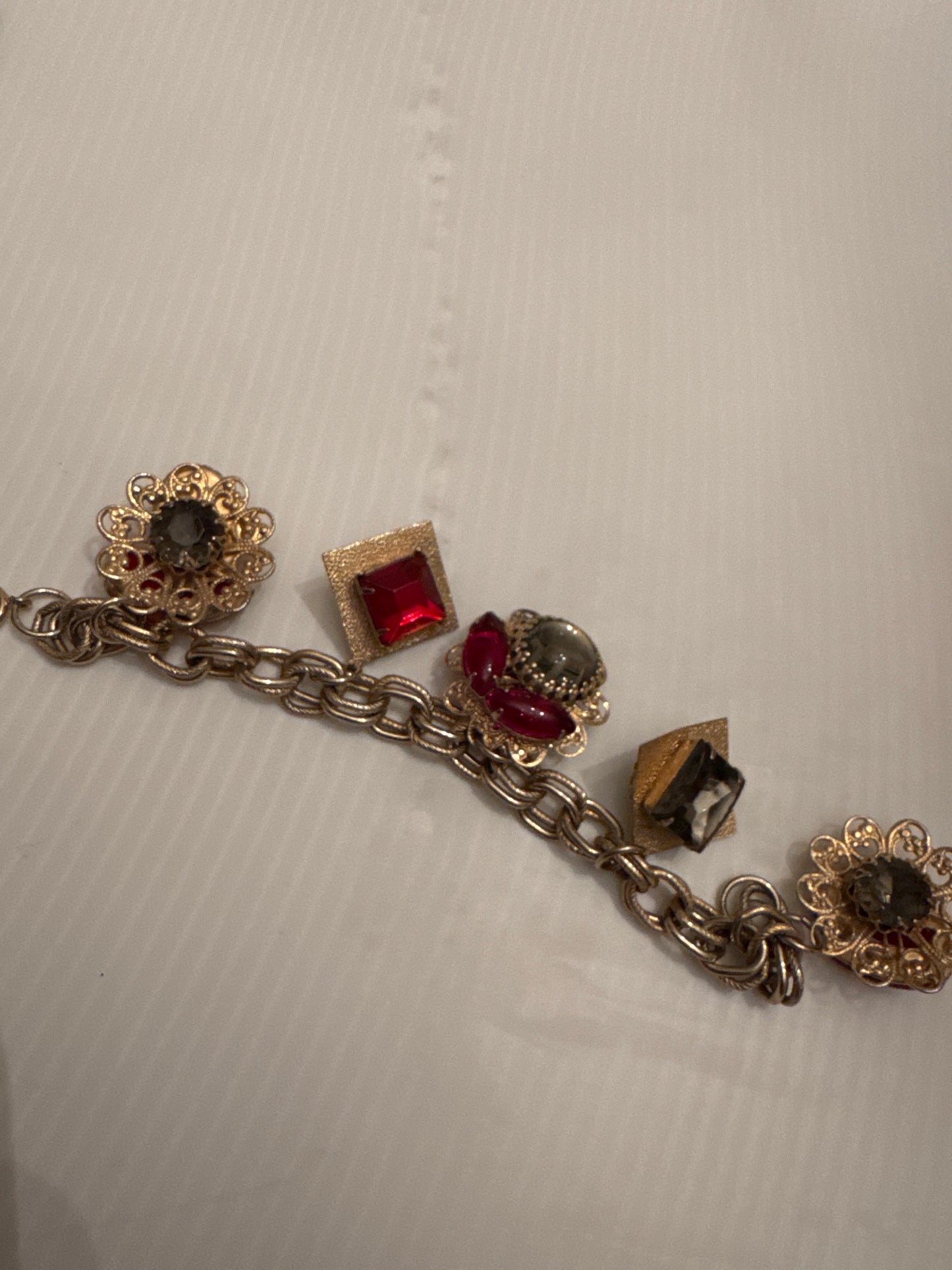 Wonderful RARE vintage double sided charm bracelet in gold tone with red stones and fabulous moonstones