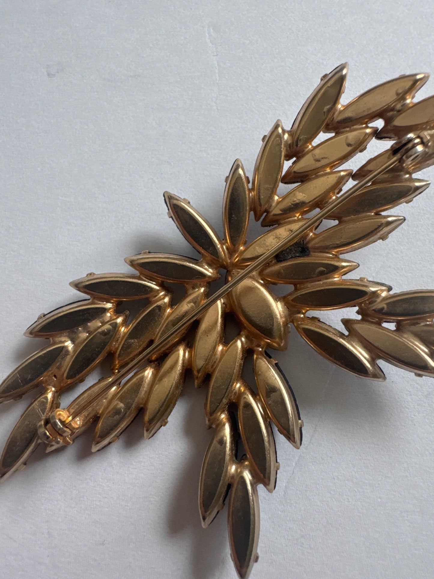 Beautiful 1950s D & E butterfly navette brooch featuring black and amber colored rhinestones