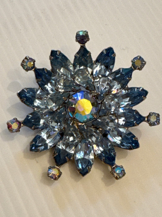 Beautiful, signed Weiss snowflake brooch with blue rhinestones. Tom
