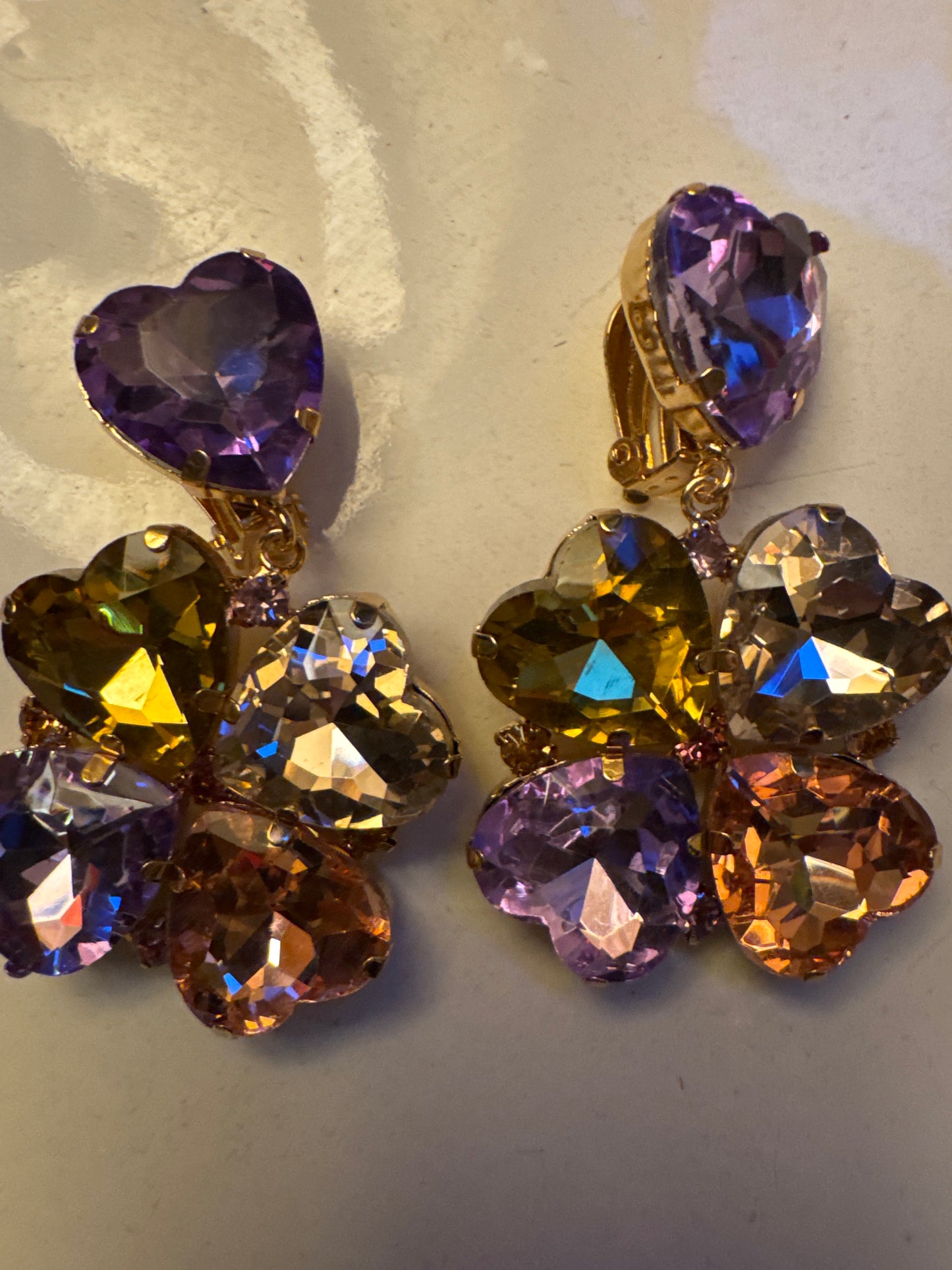vintage 1980s jumbo dangle rhinestone earrings with heart top and flower dangle