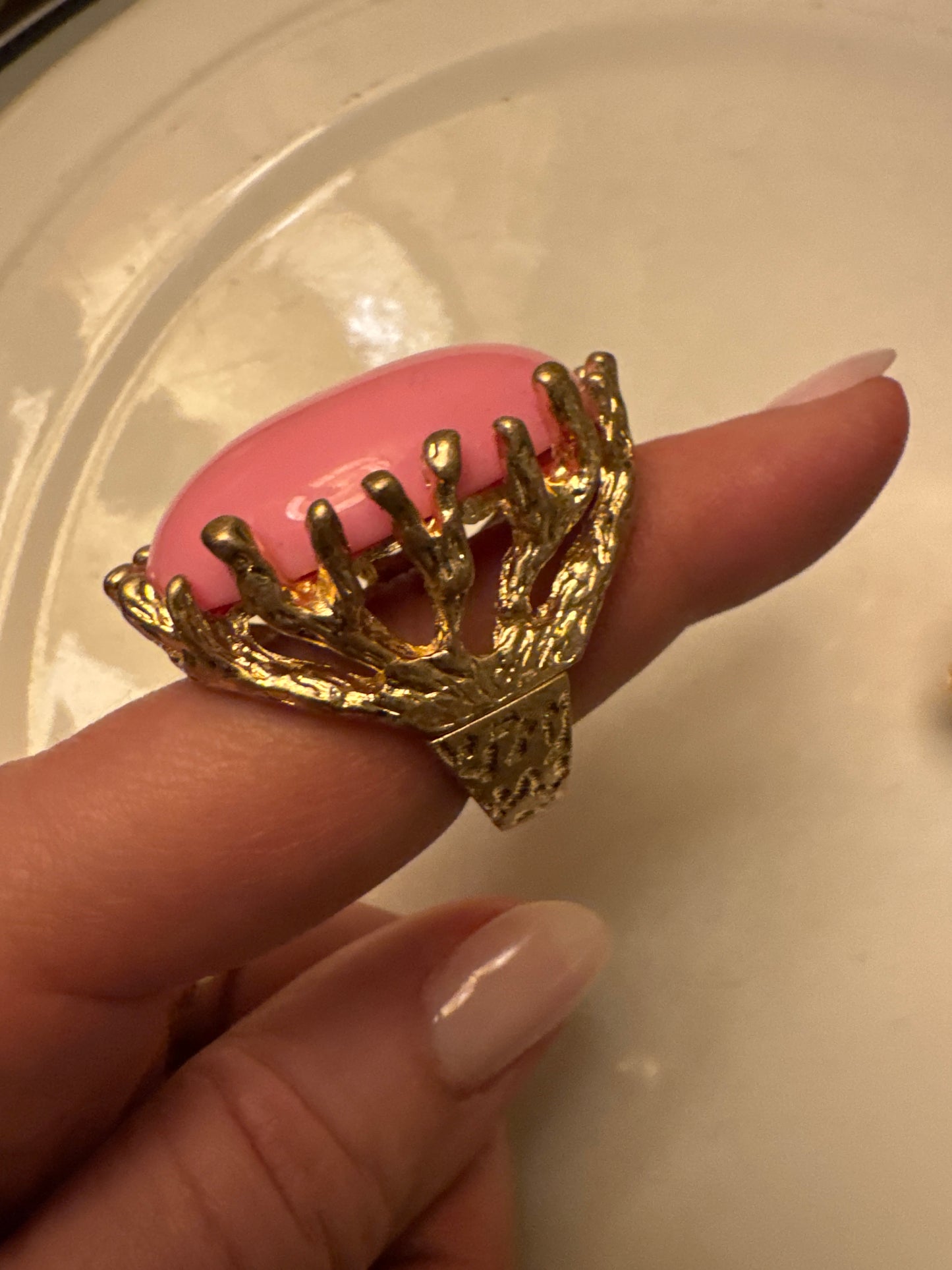 The ultimate summer 1980s cocktail ring with pink Centerstone and gold tone. Sourced in Paris.