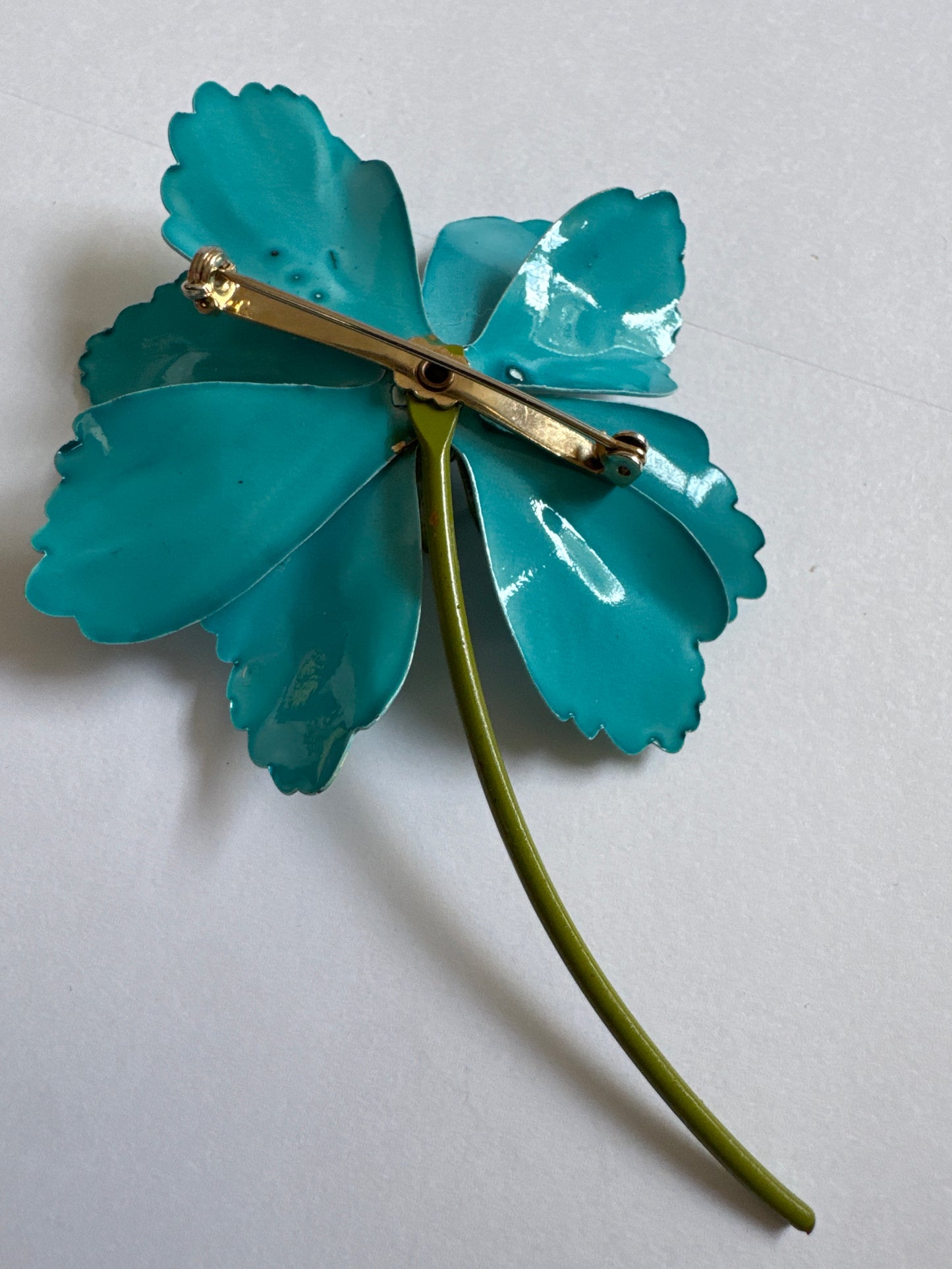 1960s tin flower cut out brooch in gorgeous, turquoise, and green