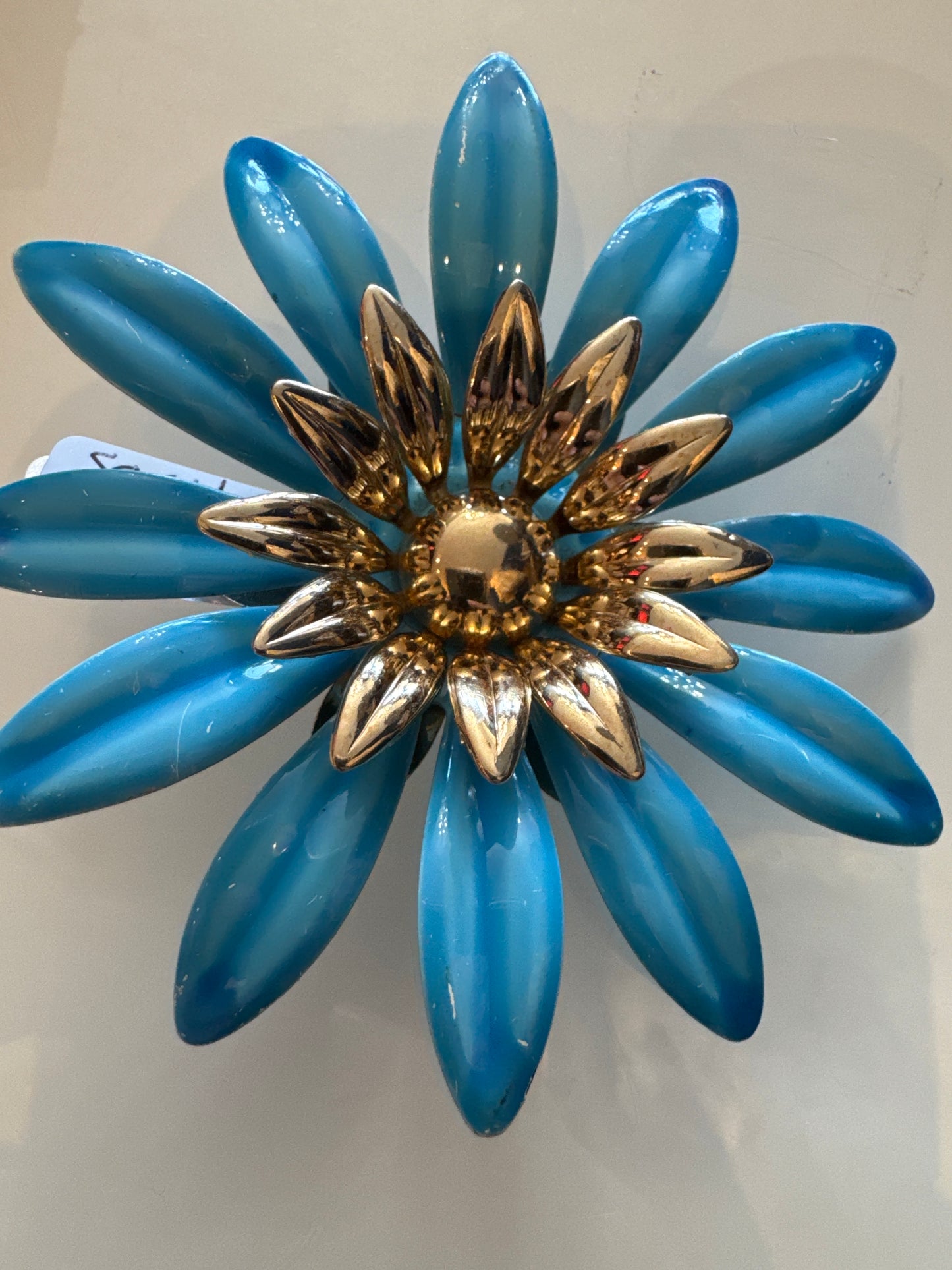 Blue enamel and gold tone, jumbo brooch, signed Sarah Coventry