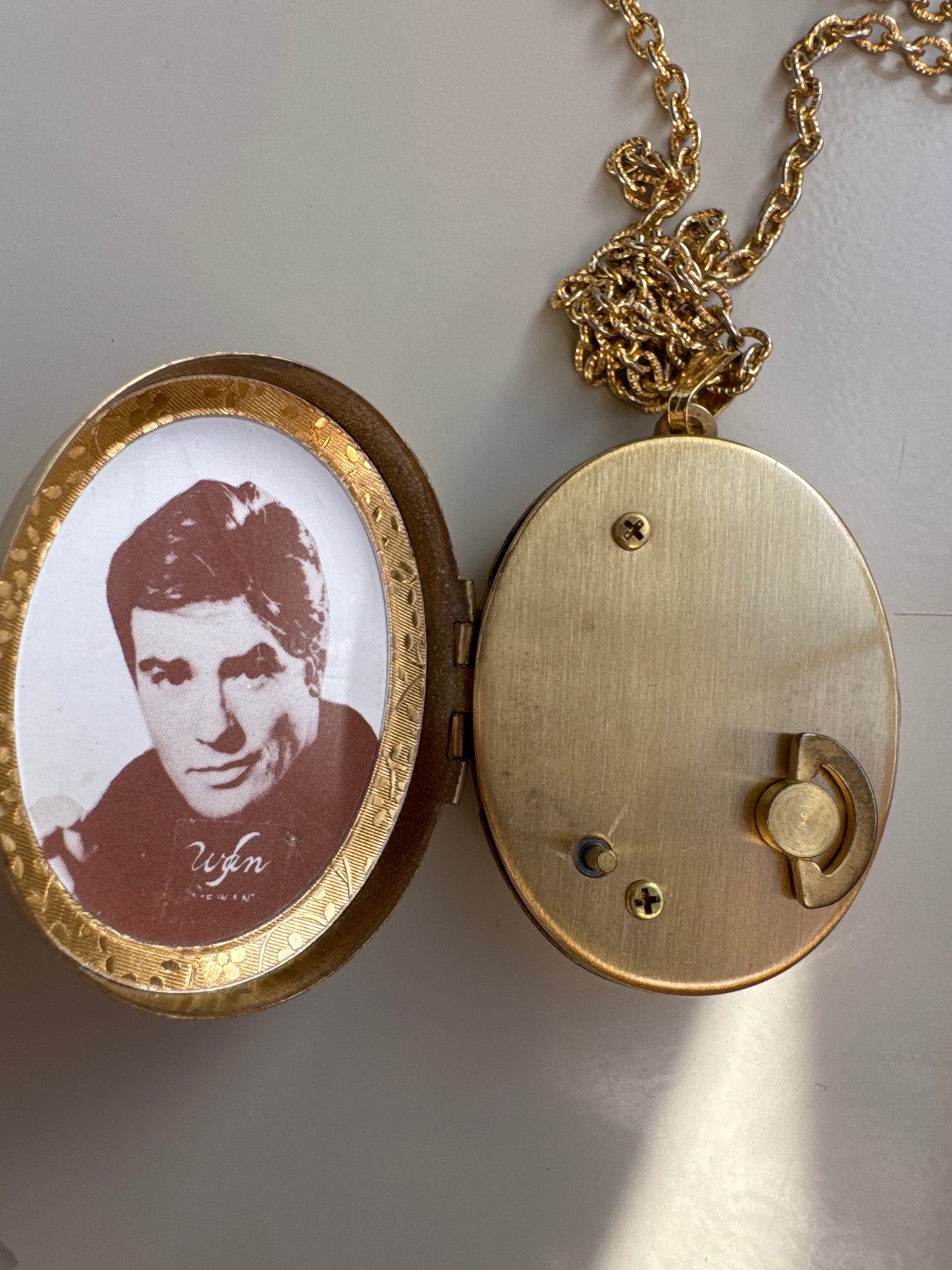 Music box cameo plays Love Story. Tom