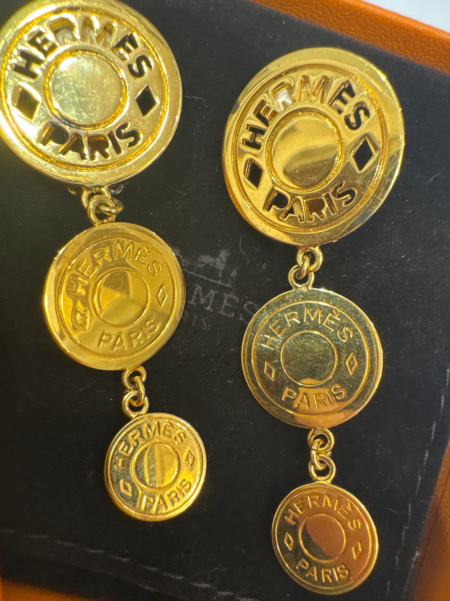 Vintage Hermes gold tone, three drop coin earrings