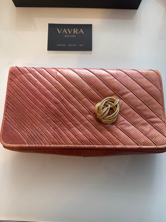 Beautiful vintage Judith Leiber salmon colored water snake clutch with crossbody  strap comes with decorative brooch.