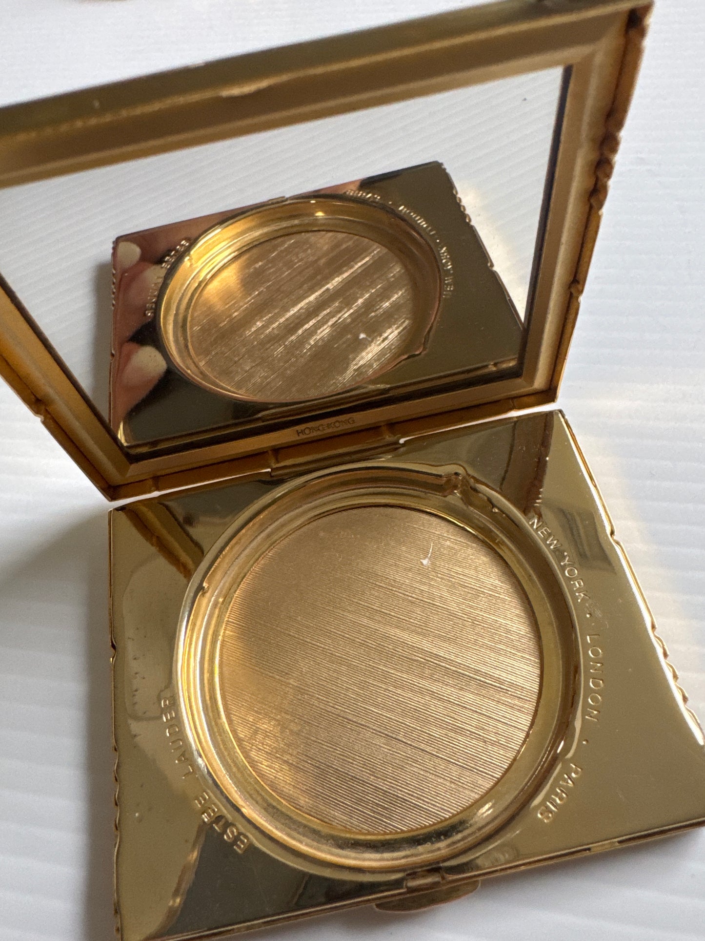 vintage, Estée Lauder, gold starburst, refillable makeup compact marked, made in Hong Kong