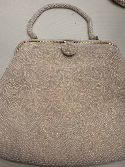 Beautiful white beaded top handle bag with gold frame and light green satin interior by Walborg