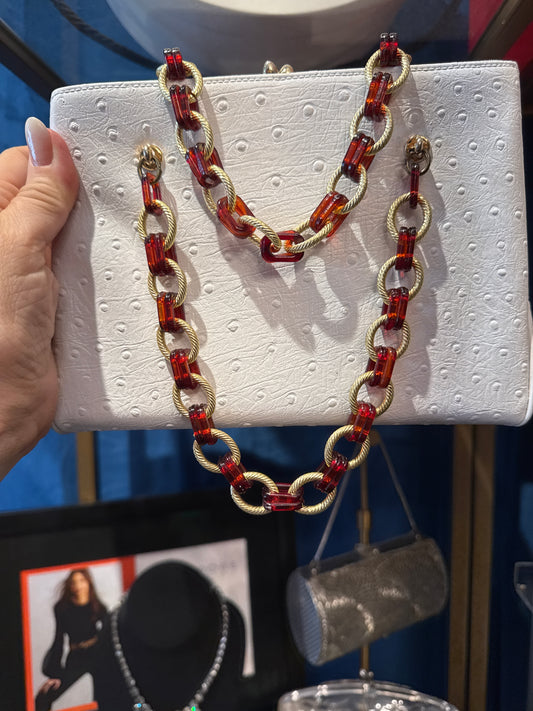 Beautiful white ostrich with lucite and gold tone link chain handbag