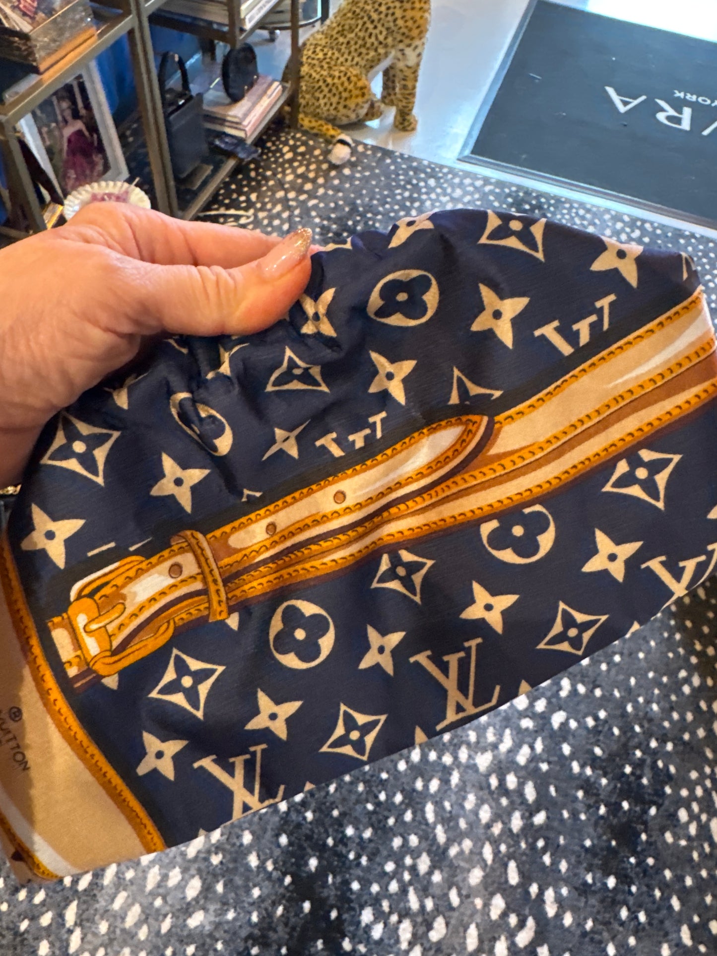 Vintage medium navy silk scarf reimagined as a clutch bag. Comes with crossbody chain shown