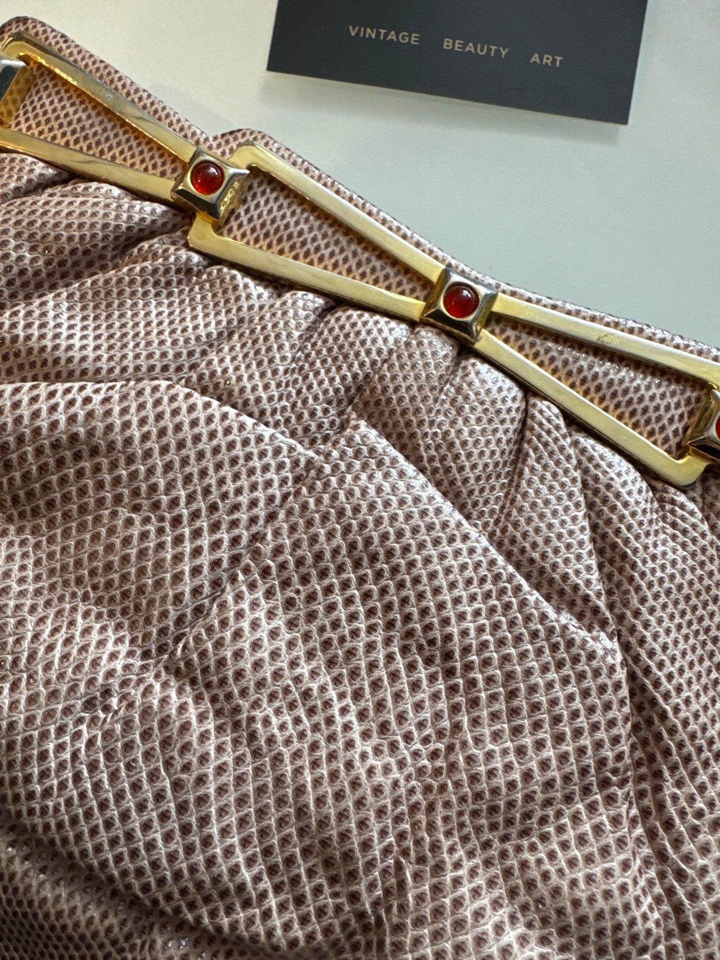 Beautiful vintage, Judith Leiber water snake clutch bag in beige with gold hardware and red cabochons. Comes with the shoulder strap.