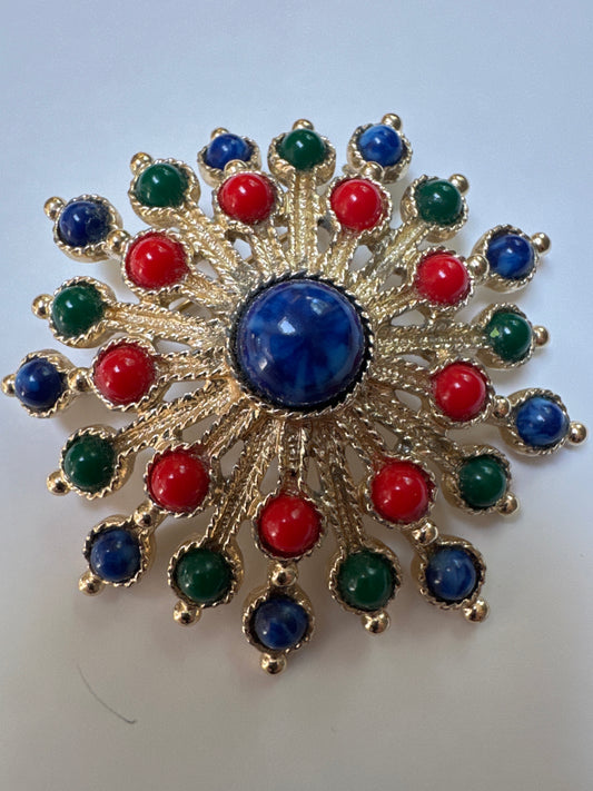 1970s vintage sarah Coventry starburst brooch in gold town with red green and blue cabachon stones