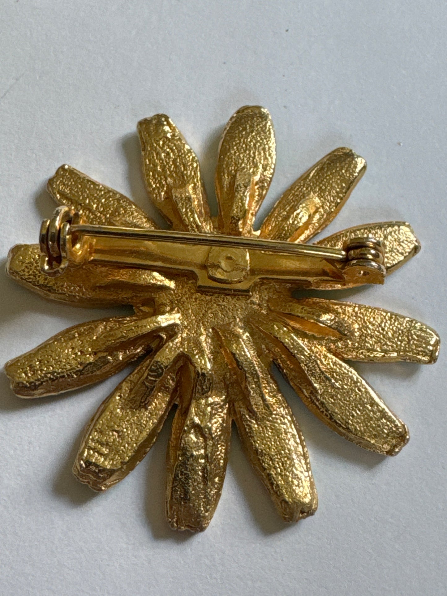 1960s flower power brooch in green and blue on gold tone