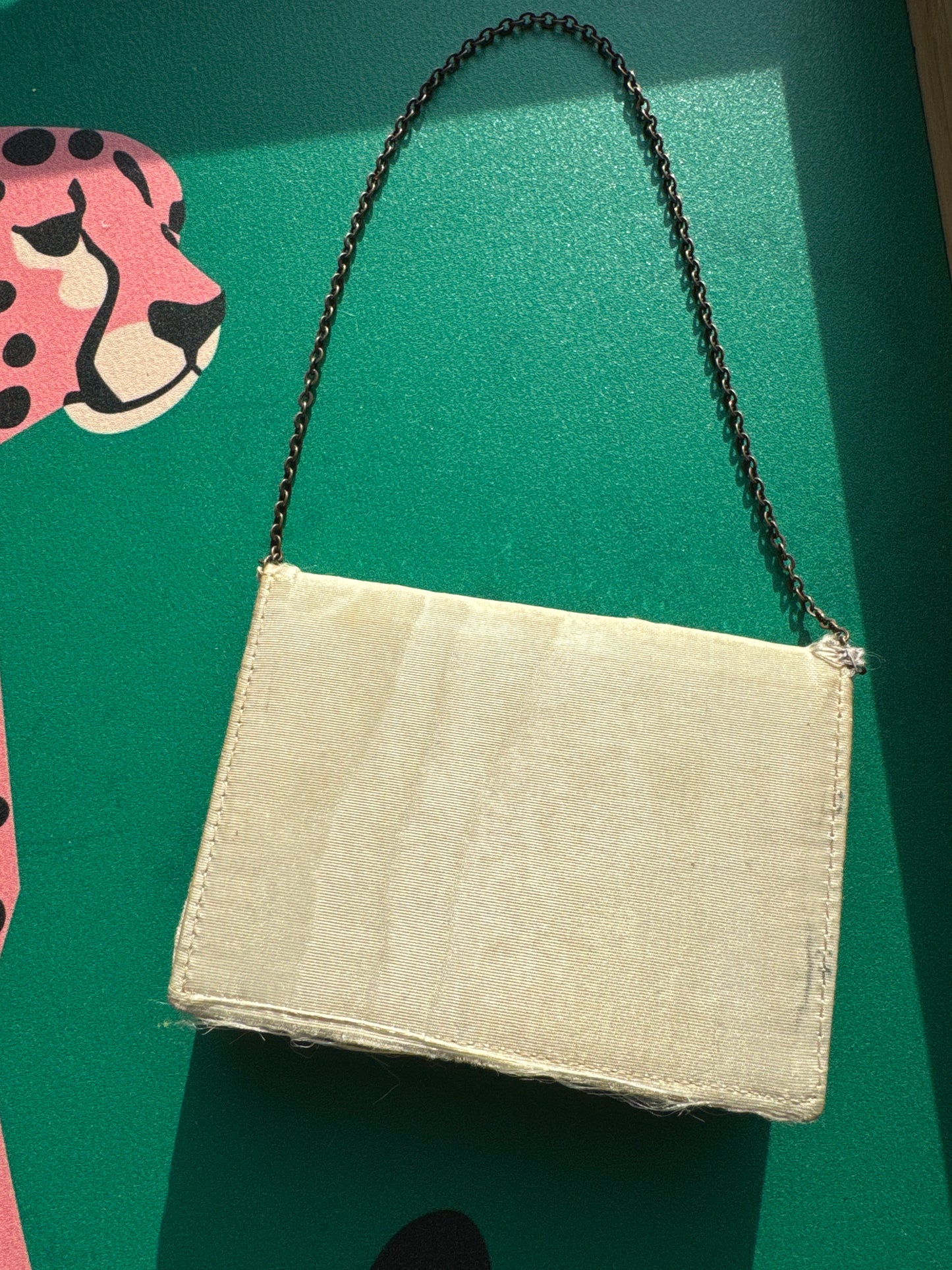 Beautiful rhinestone and enamel art deco 1920s modernist mini minaudiere with chain. Celluloid with geometric in layers, give it the jazz age glamour. Over 100 years old!