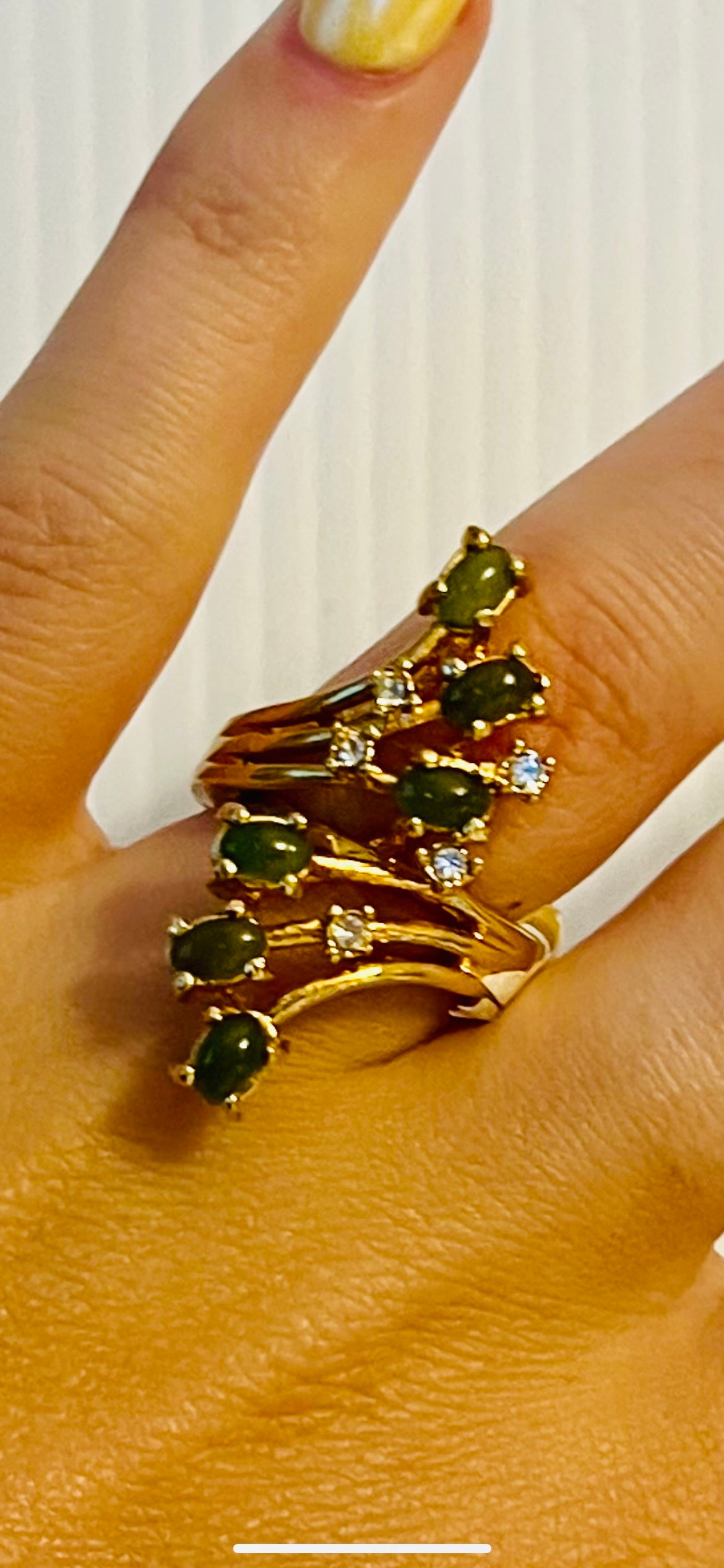 Vintage gold tone ring with green gems and silver rhinestones. Oscar worthy!