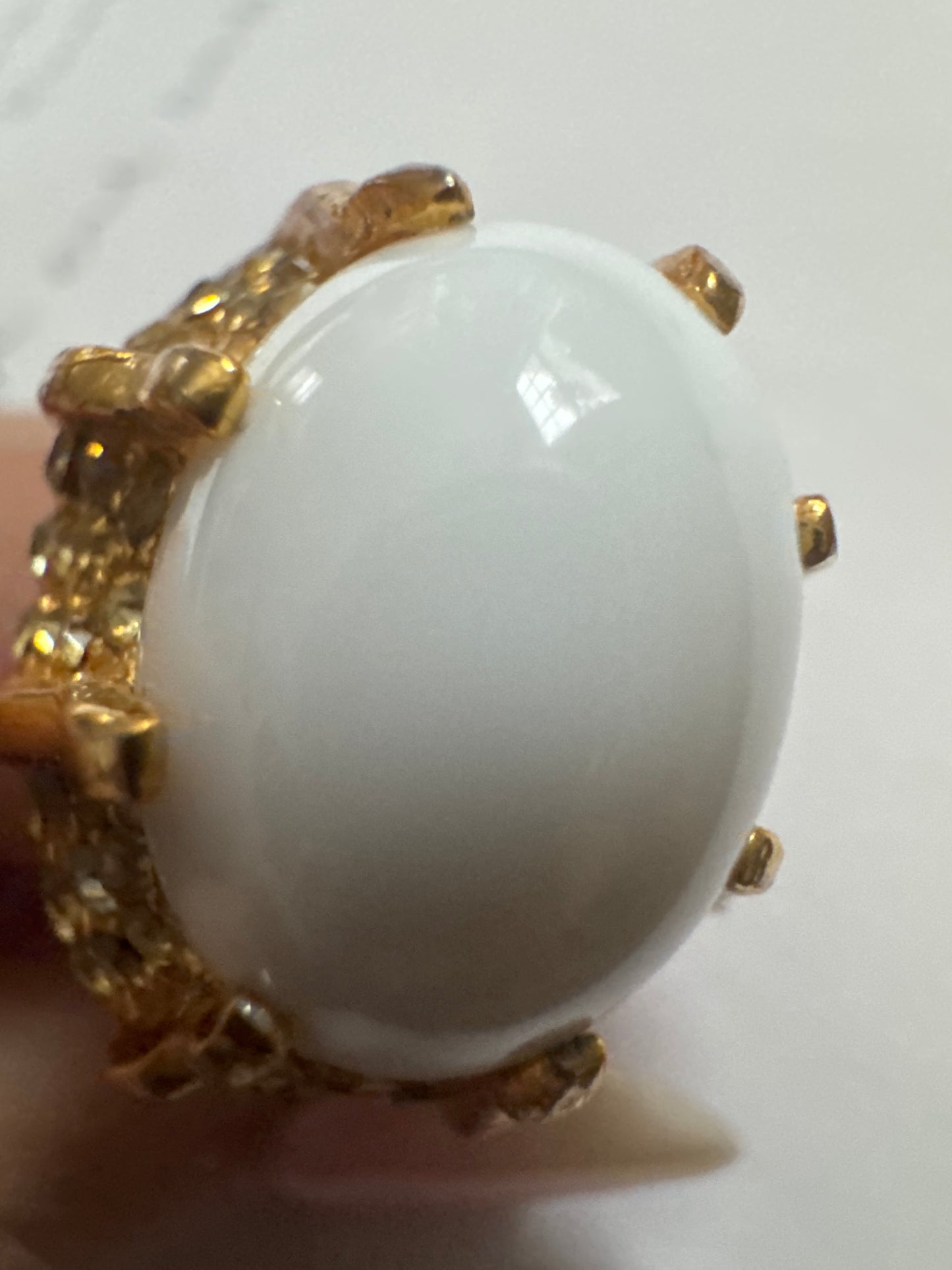 1980s signed Kenneth Lane cocktail ring with white cabochon and rhinestones