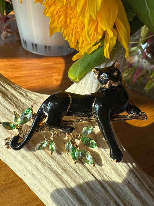 Signed vintage Napier enamel panther brooch with green rhinestones