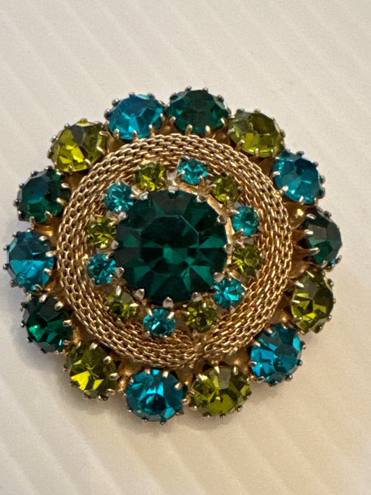 very special Weiss signed, brooch withturquoise and olive colored rhinestones. Tom