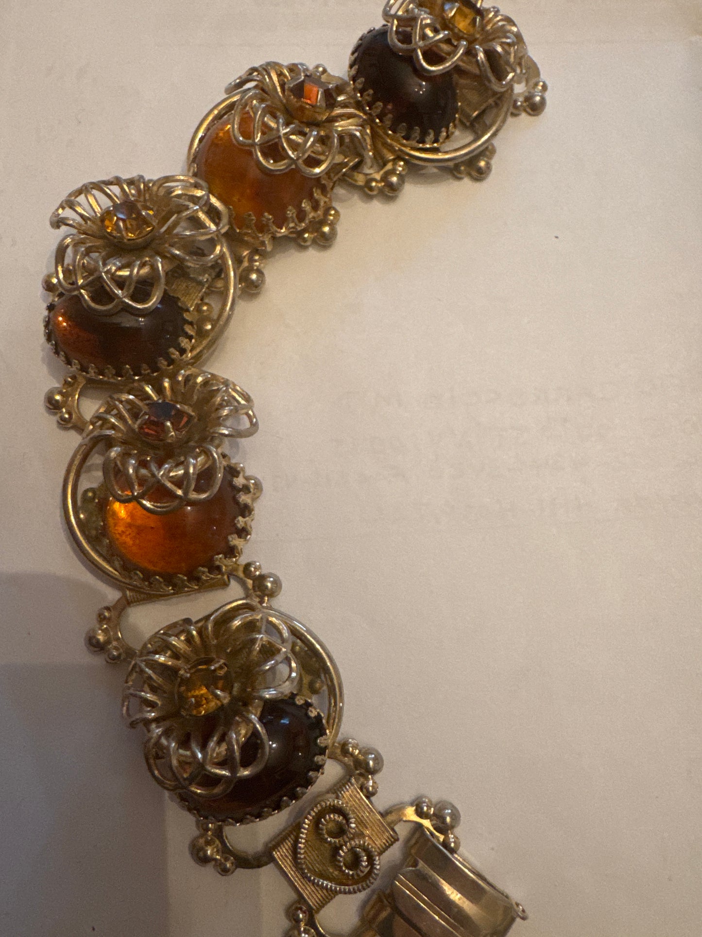 Beautiful 1940s Amber colored rhinestone and gold tone bracelet. Sourced in Paris.