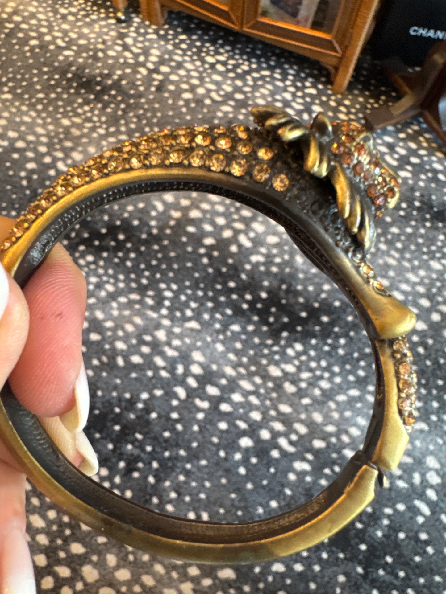 Beautiful vintage bronze, lion rhinestone clamper with green eyes