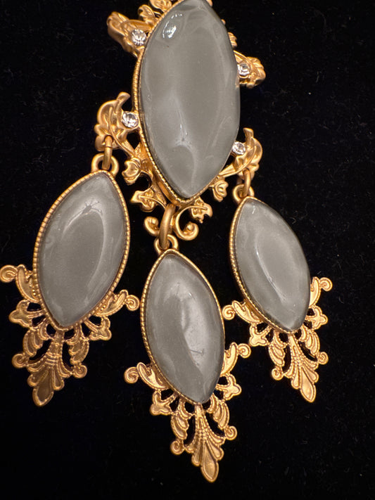 1990s jumbo lightweight, gold tone brooch with greenish Grey stones. France