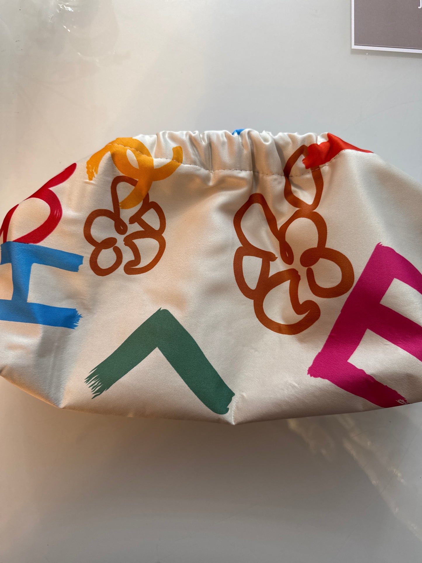 Designer silk scarves reimagined as Crossbody/clutch bags. Size large.