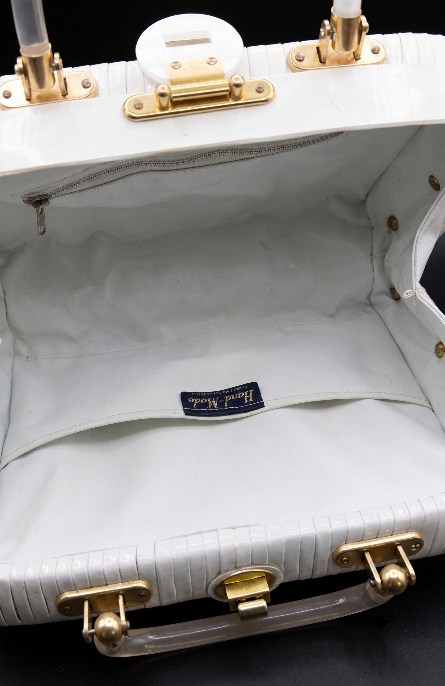 Beautiful 1950s white wicker bag with mother of pearl in the center and lucite handles