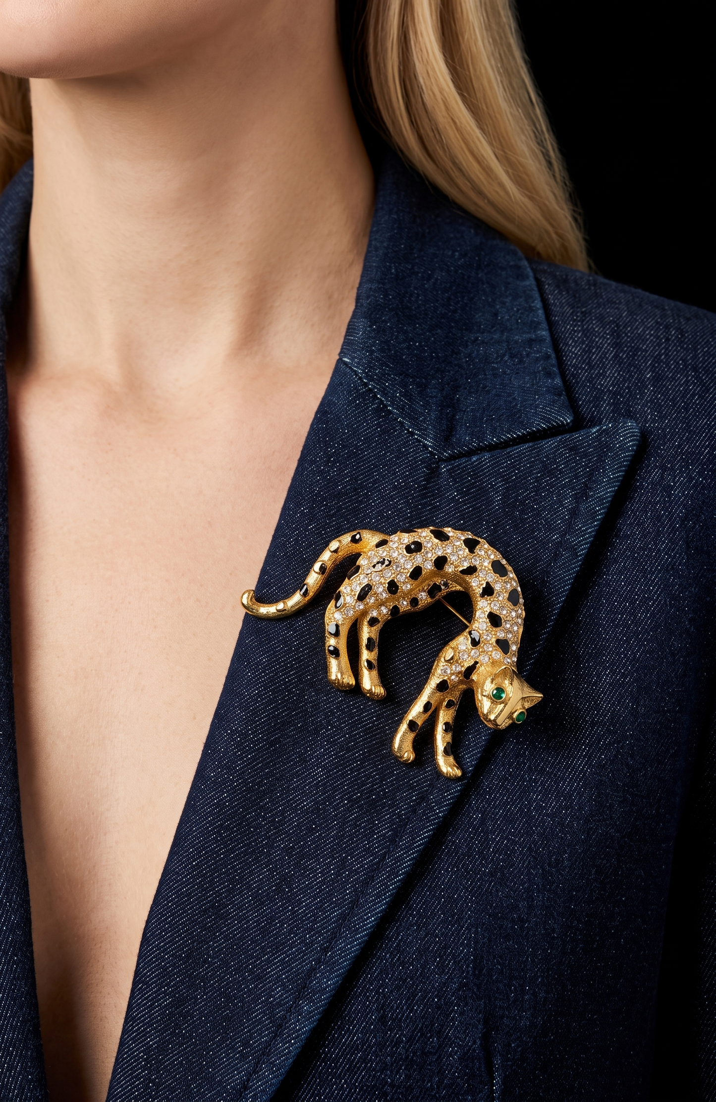 1960s panther brooch with clear, crystal rhinestones and emerald colored eyes. Black enamel spots ~ some need a little touchup, or not.