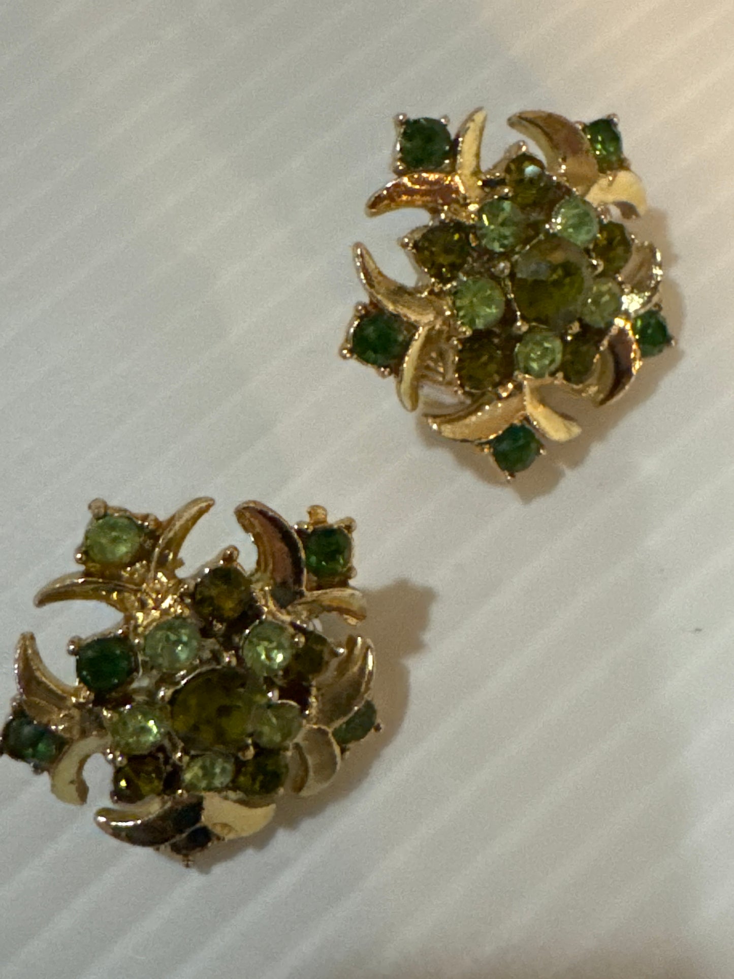 Spectacular small size clip on earrings with green rhinestones