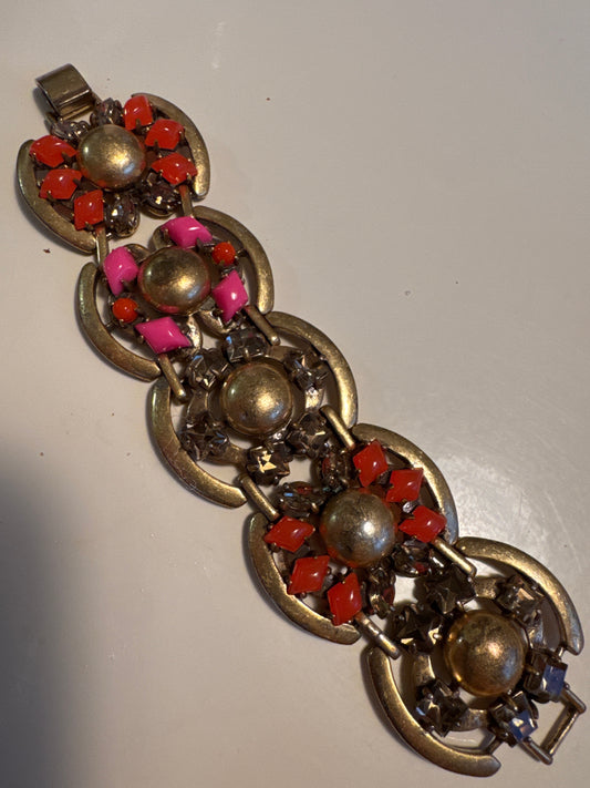 Signed 1990s brass vintage flower bracelet with pink orange and amber colored rhinestones.