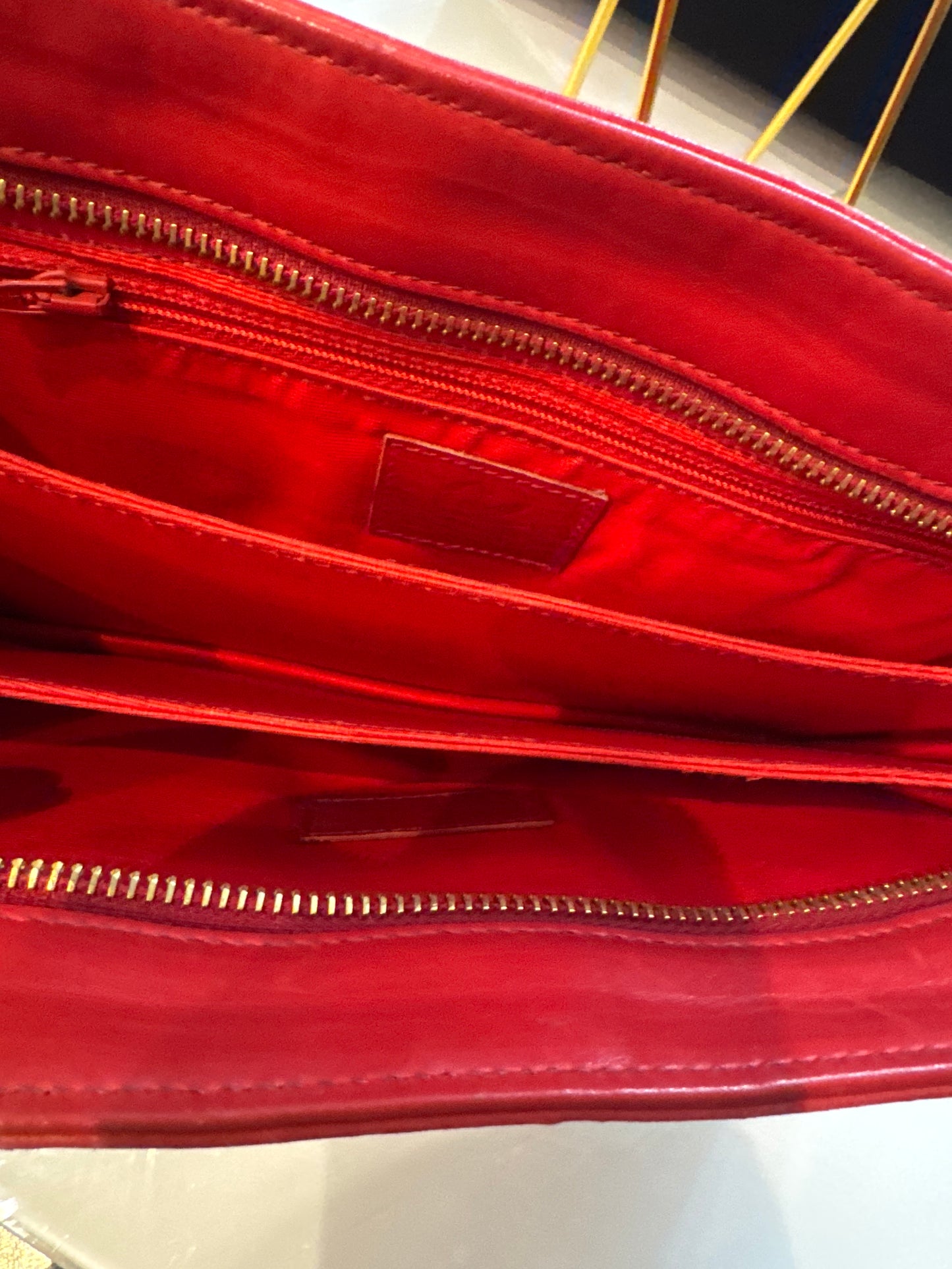 stunning vintage 1980s buttery leather CHRISTIAN LACROIX clutch bag in red and black with jewel zipper pull