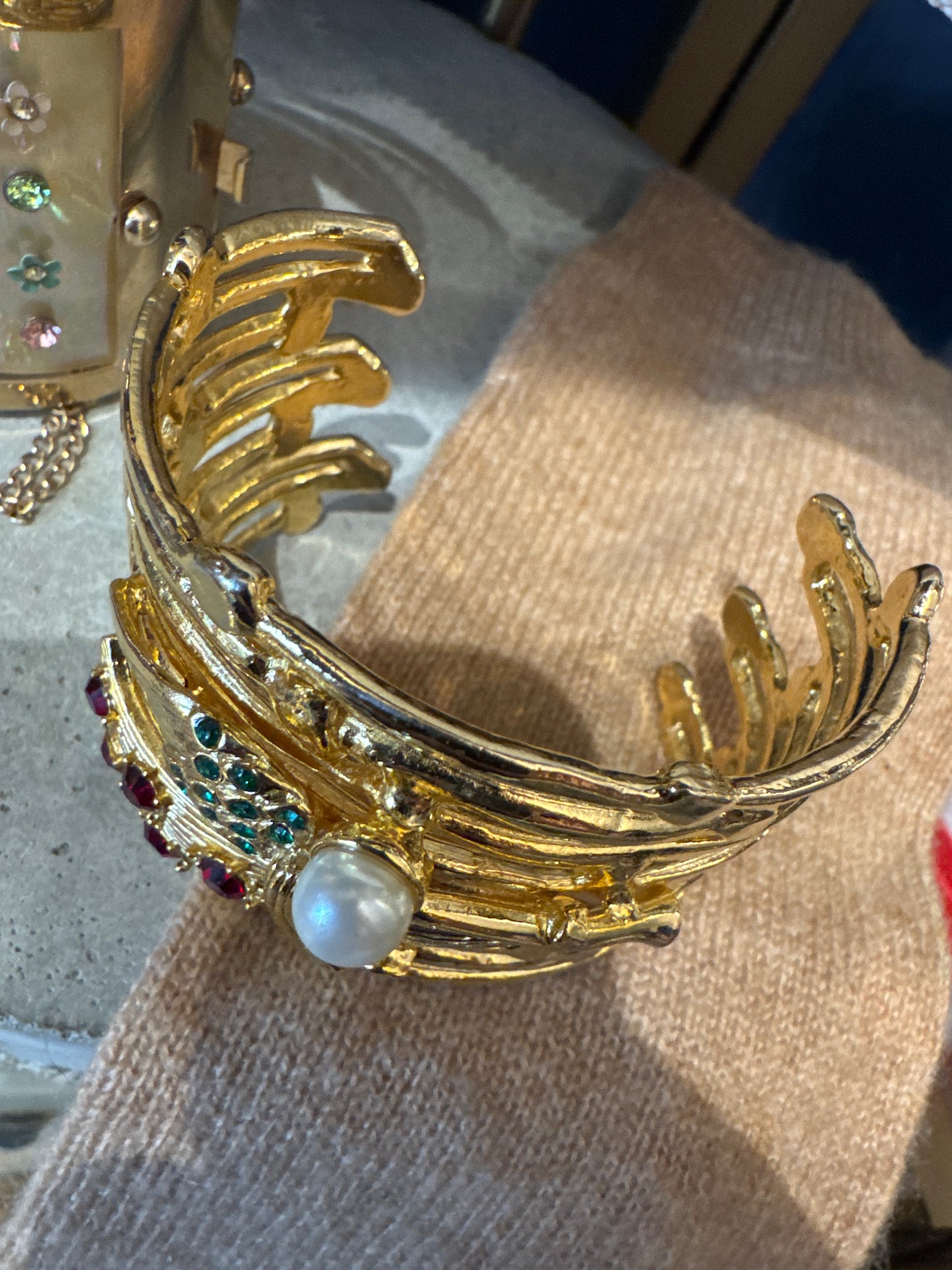 1980s vintage cherub gold tone cuff bracelet with rhinestones and faux pearl